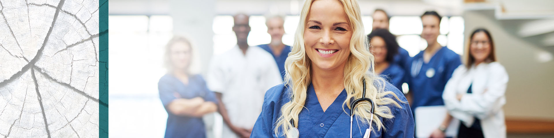 Female nurse practitioner stands in front of medical team